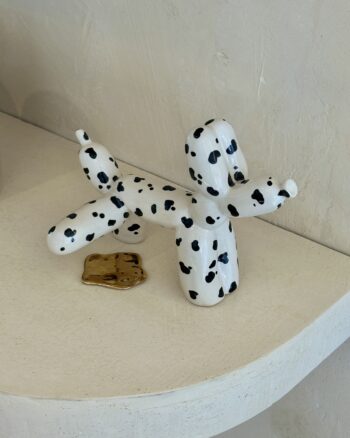 perrito con charquito de pipi oro 24k